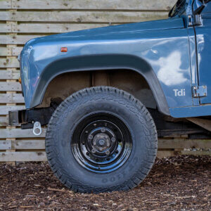 A defender sat on Modular black steel wheels