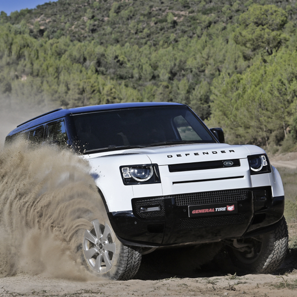 A 4X4 driving up a rocky hillside sat on All Terrain Tyres showing they can Master Every Mile