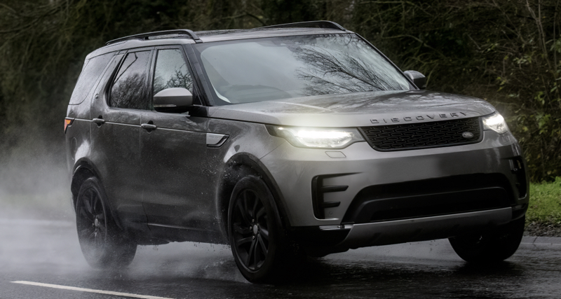 a land rover driving down the road showing - Great Tyres for Daily Driving