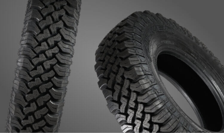 A Falken wildpeak mud terrain tyres shown on grey background