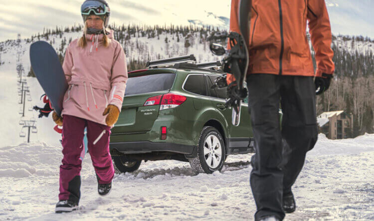 A couple walking off to go ski there 4x4 is in the background sat on BFGoodrich Trail Terrain