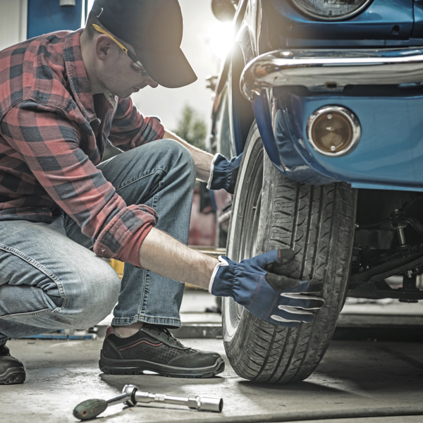 A classic car having its tyres replaced by a Fitting Services Nationwide