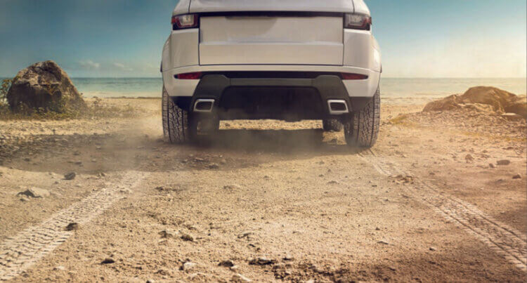 A 4x4 vehicle driving on a off road track sat on Continental 4x4 Contact tyres.