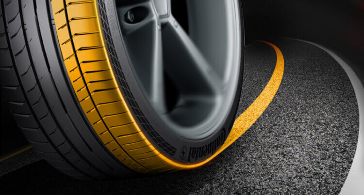 a cross section of a continental tyre. Orange to illustrate the Grip and Handling