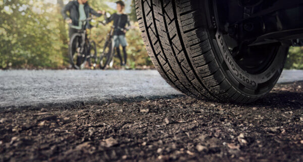 Continental Cross Contact tyre on the road with family on bikes behind
