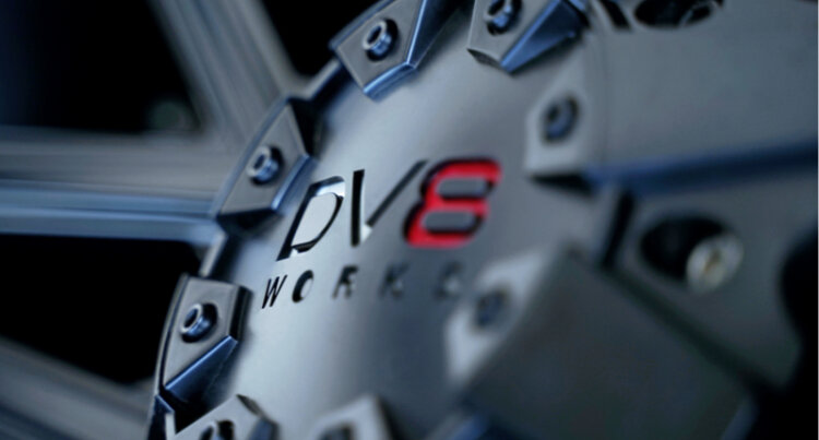 A close up of the dv8 works logo on an alloy wheel.