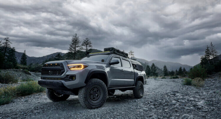A large 4x4 offloading on a rocky trail to show falken wildpeak at3w