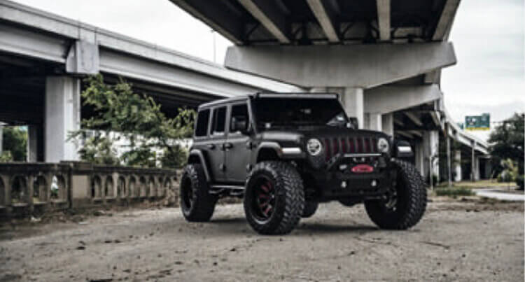 A Jeep in an urban setting sat on Fuel Offroad wheels advanced technology