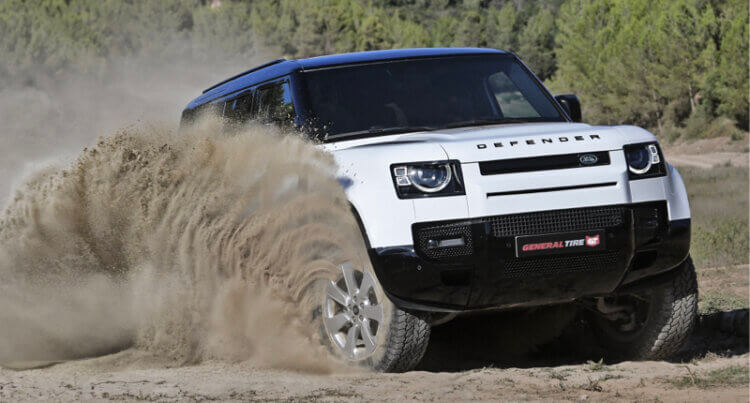 A Land Rover sat on general grabber tires to illustrate general grabber All Terrain Tyres