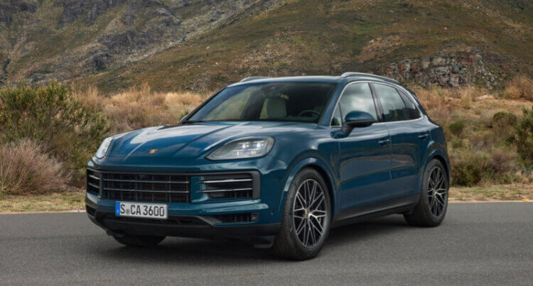 A Porsche Cayenne SUV sat A Pirelli SUV tyres showing the Pirelli scorpion tyres