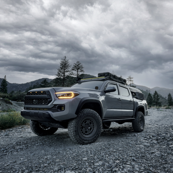 A truck in forest using rugged terrain tyres as an example of What Are Rugged-Terrain Tyres?