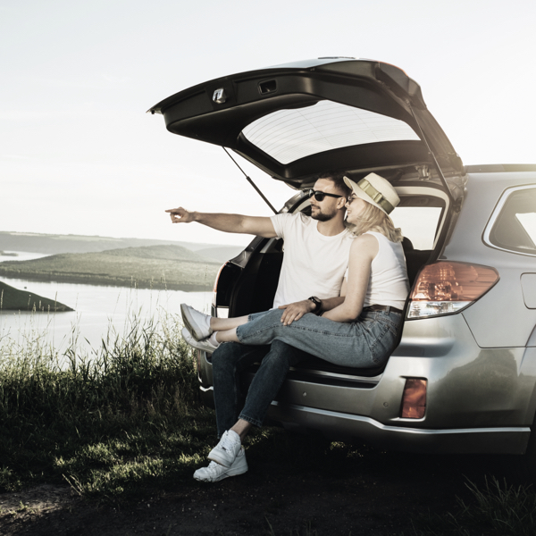a happy couple at in there car showing that the right Tyres matter